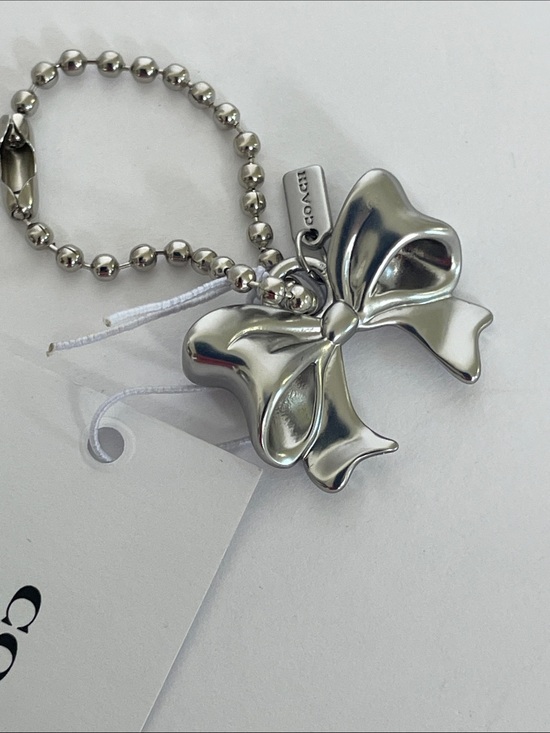 Coach Handbags - NWT Coach New York Exclusive Silver Bow Charm